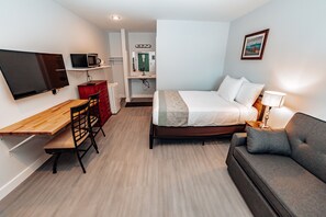 Quarto econômico | Cortinas blackout, berço de viagem, Wi-Fi de cortesia, roupa de cama