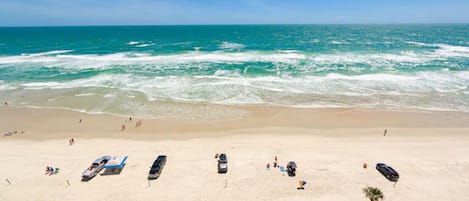 On the beach, sun loungers, beach towels