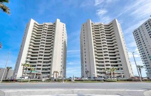 Stunning high-rise building with balconies on every floor, offering breathtaking views.