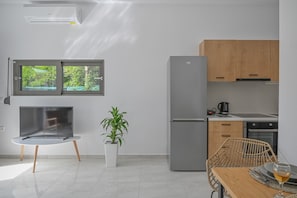 Apartamento standard | Cozinha privada | Geladeira grande, fogão, cooktop, cafeteira/chaleira