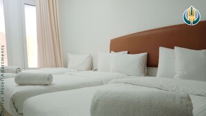Egyptian cotton sheets, premium bedding, memory-foam beds, free WiFi - Capital hotel apartments (Muscat)