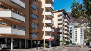 A multi-story building with balconies, a no entry sign, and a clear blue sky. - Locarno City Apartments (Locarno)