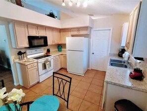 Fridge, microwave, oven, stovetop - Entire 4 BR Vacation House Near Disney w/ Pool (Clermont)