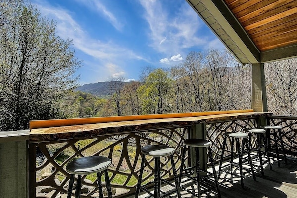 Back porch has the views! Hot tub, outdoor gas grill, and firepit all out here!