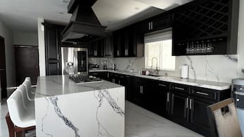 Fridge, microwave, stovetop, coffee/tea maker