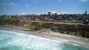 A coastal town with a beach, houses, and a road. - Beach View Bungalow with Stunning, Panoramic Views (Encinitas)
