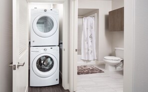Combined shower/tub, hair dryer, towels, soap