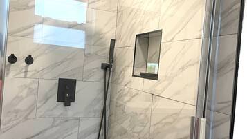 Shower, hair dryer, towels, soap