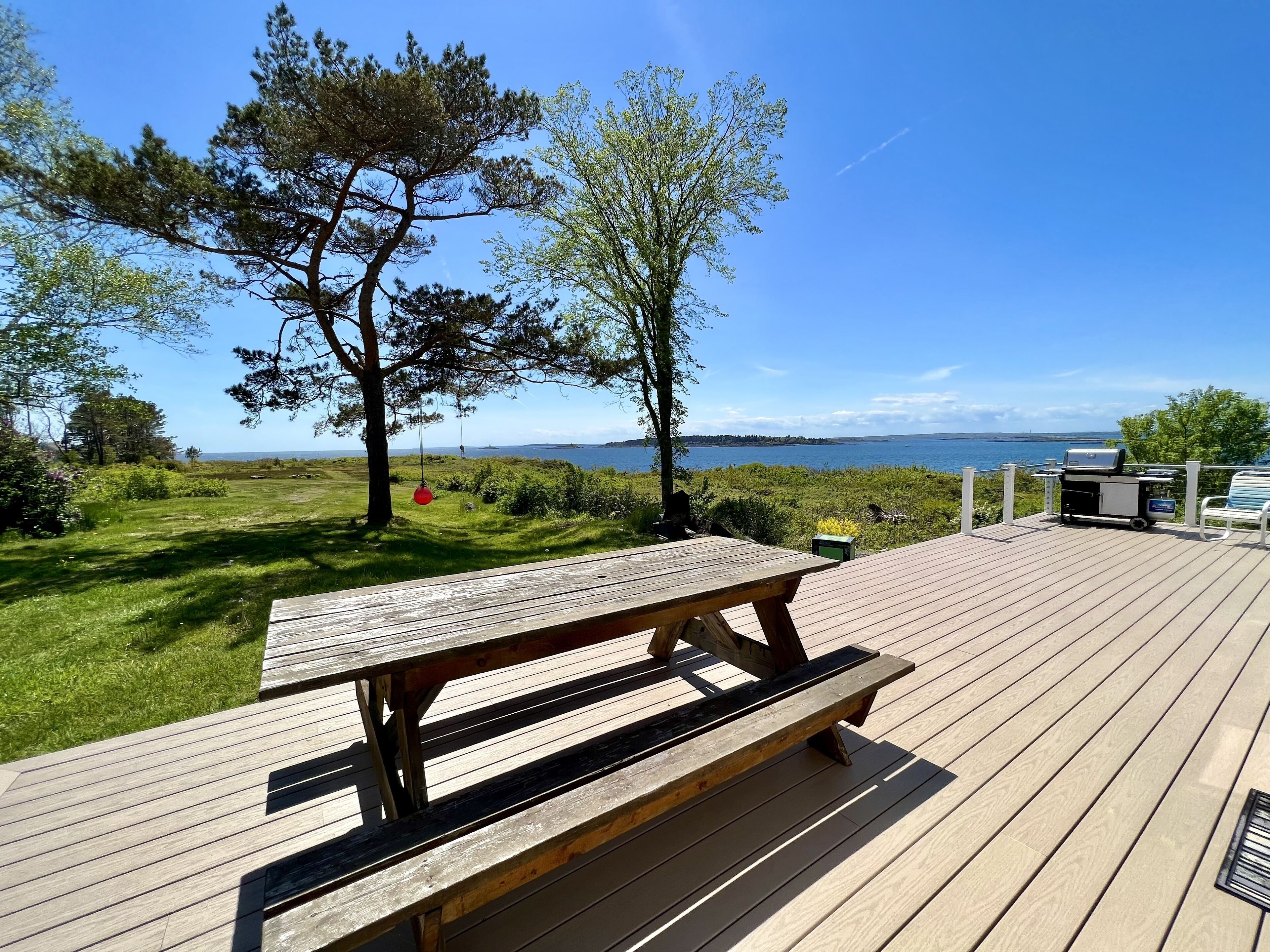 Enjoy picturesque inlet views of a working harbor and sunny days at your oceanfront cottage