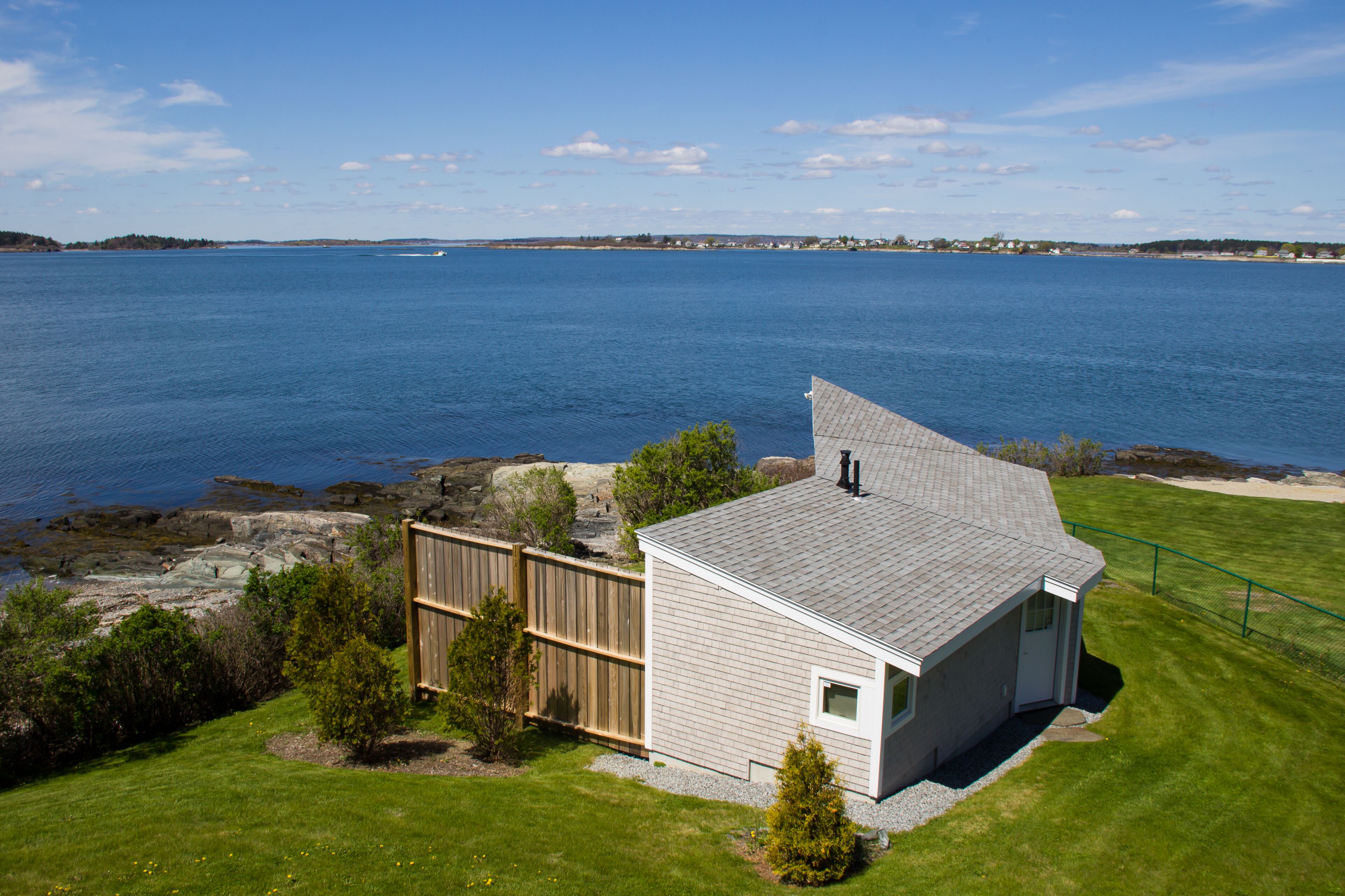 This sweet cottage offers a shared pebbly beachfront and gorgeous sunset views