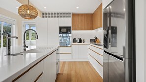 Dishwasher, coffee/tea maker, dining tables