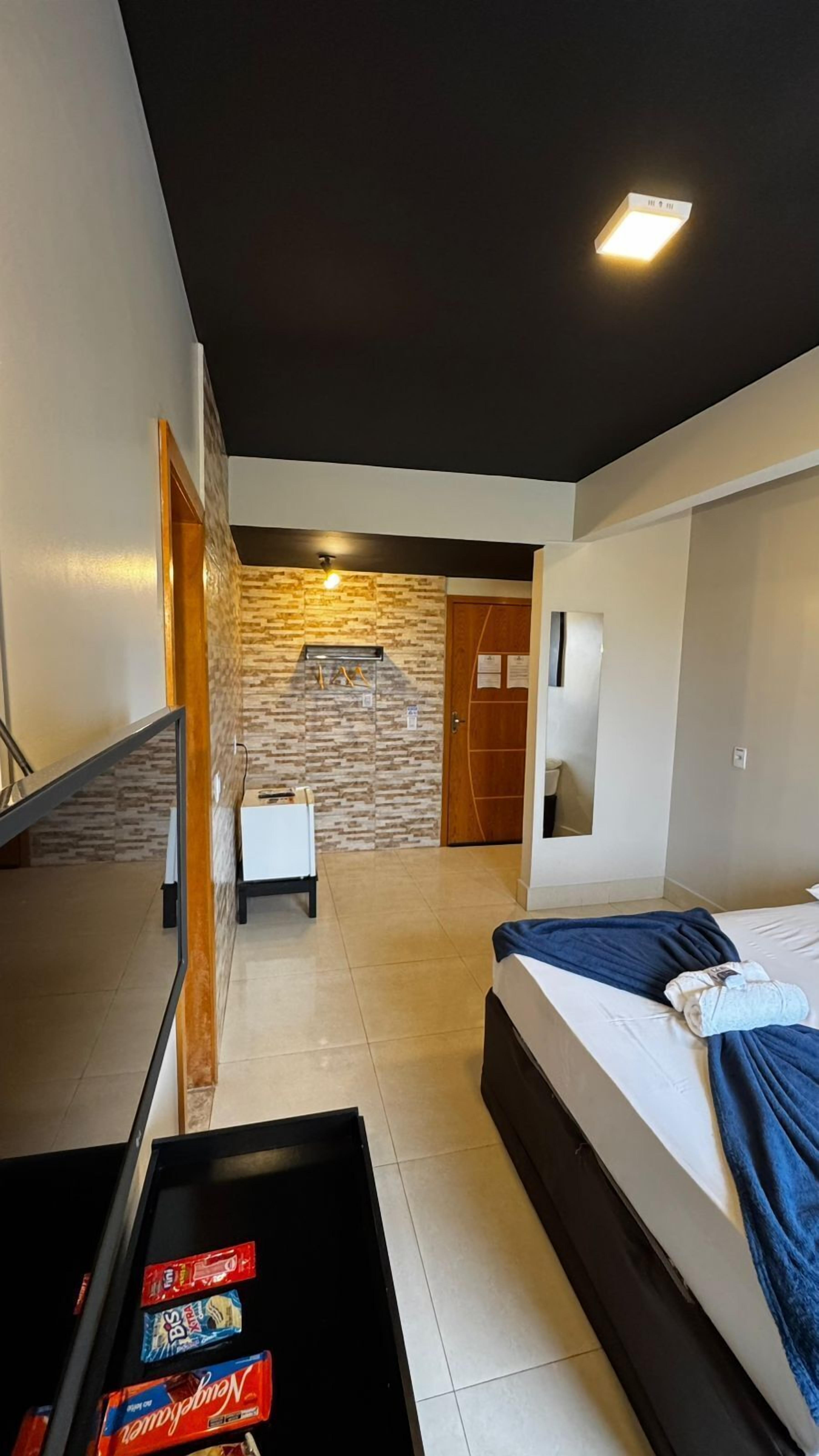 Quarto premium, 1 quarto, ar-condicionado, vista para a cidade | Roupas de cama premium, camas Select Comfort, frigobar