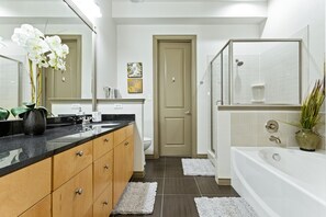 Combined shower/bathtub, hair dryer, towels, soap