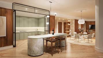 Enjoy a contemporary atmosphere in this inviting space with a central island, kitchen, and comfortable seating area.
