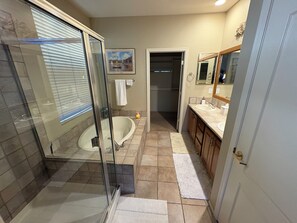 Combined shower/tub, hair dryer, towels, soap