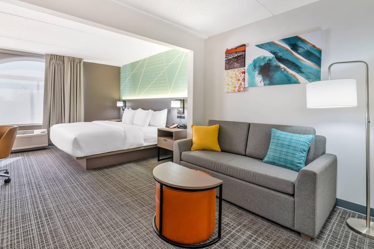 Premium bedding, desk, laptop workspace, soundproofing