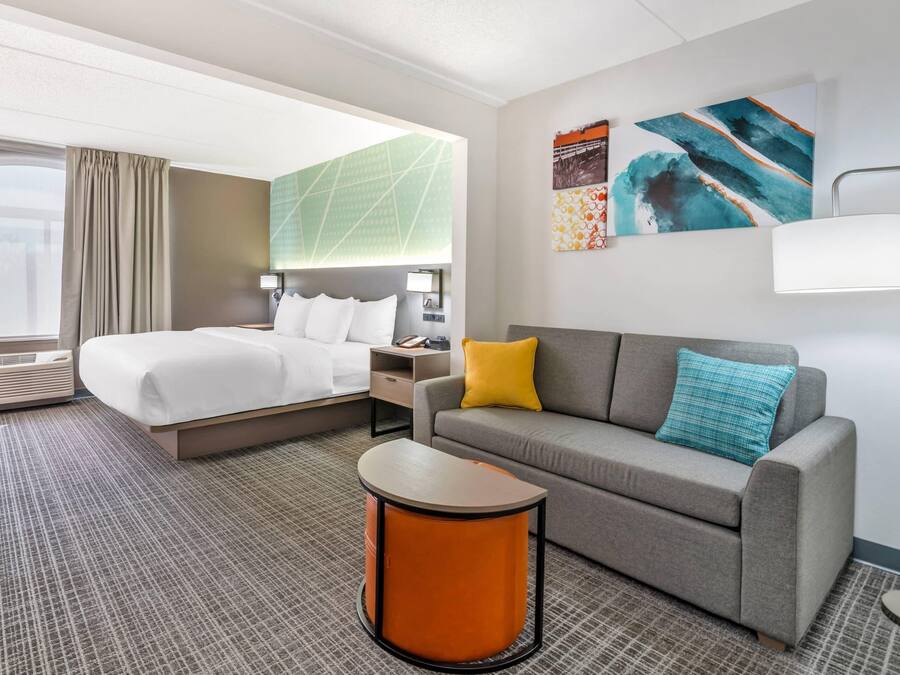 Premium bedding, desk, laptop workspace, soundproofing