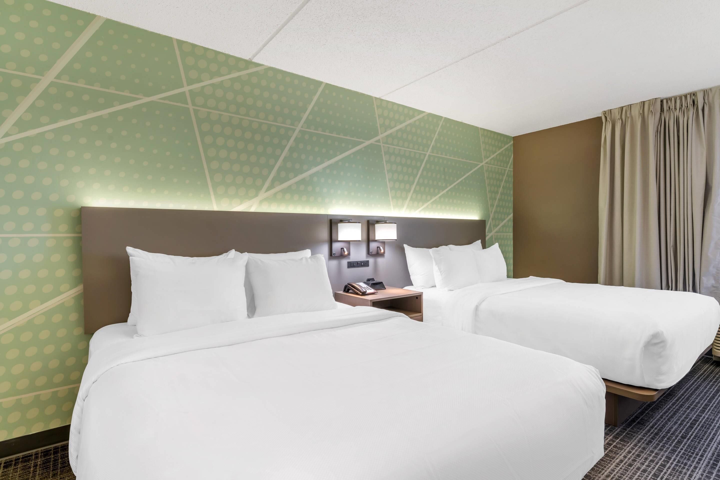 Premium bedding, desk, laptop workspace, soundproofing