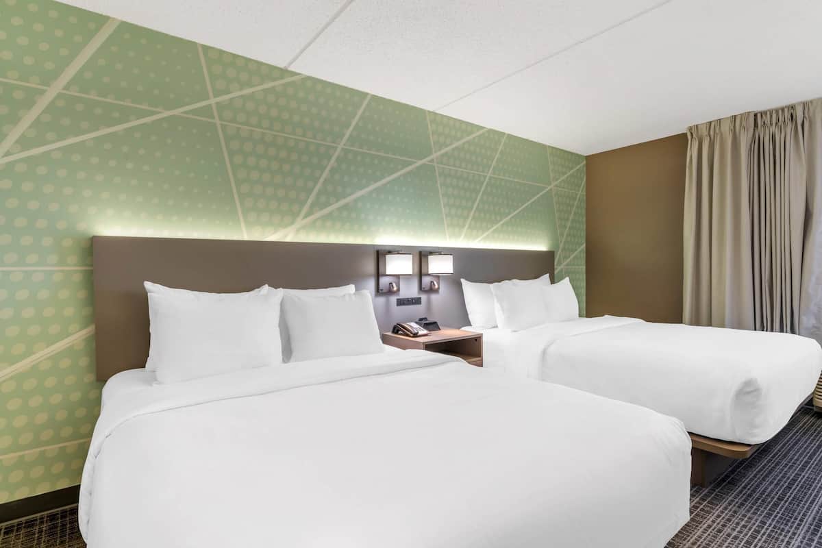 Premium bedding, desk, laptop workspace, soundproofing