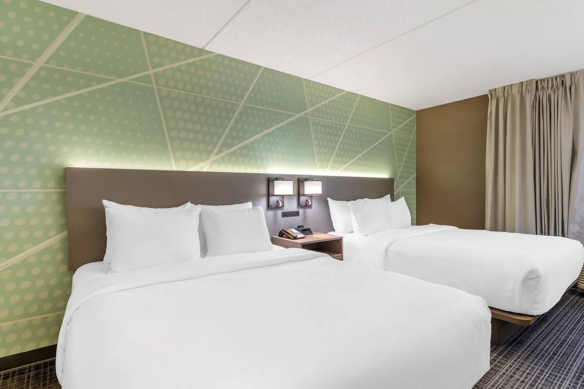 Premium bedding, desk, laptop workspace, soundproofing