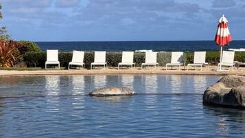 On the beach, sun loungers, beach towels