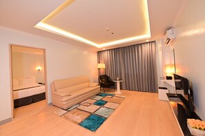 Family Room | Minibar, in-room safe, individually furnished, desk - T Shine Resort and Spa (Lapu-Lapu)