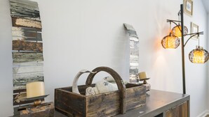 A rustic wooden bench with a woven basket containing a candle and a small decorative item. - Vacation at the most beautiful beaches (Panama City Beach)