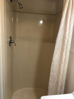 Deluxe Single Room, 1 King Bed | Bathroom | Towels, soap, shampoo, toilet paper - Deep Well Motel (Owego)
