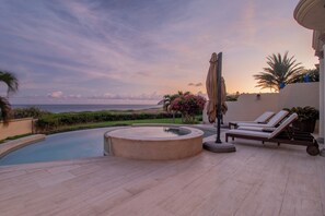 A pool area with lounge chairs, a hot tub, and a view of the ocean. - Villa Perdiz, Puerta del Sol | 4 Bed, 4 Bath (Cabo San Lucas)