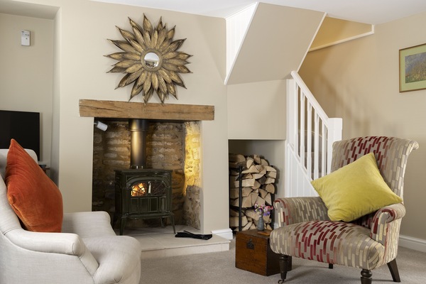 Ground floor: Settle in by the fireside after a day out exploring the local area
