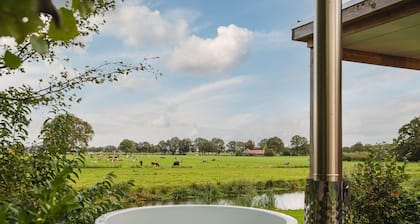 A lodge with hot tub and views over the Regge River. A sales pitch is really not necessary.