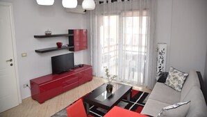Apartment, 1 Bedroom | Living area | 12-cm flat-screen TV with satellite channels, TV