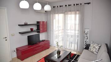 Apartment, 1 Bedroom | Living area | 12-cm flat-screen TV with satellite channels, TV