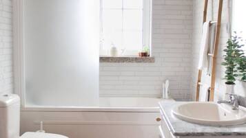 Bathtub, hair dryer, towels