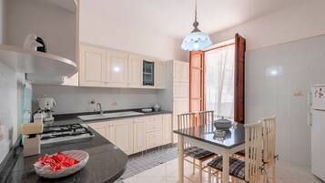 Fridge, stovetop, coffee/tea maker, cookware/dishes/utensils