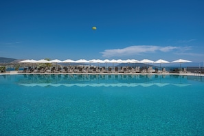 Indoor pool, seasonal outdoor pool, pool umbrellas, pool loungers