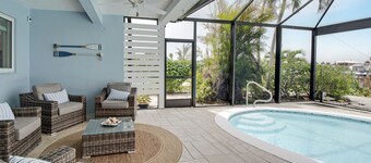 CAPRI PARADISE!  Beautiful waterfront home.  Solar heated pool, 130ft dock.