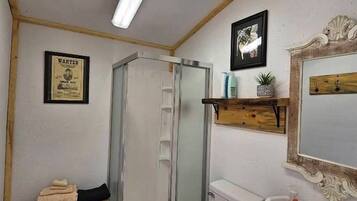 Shower, hair dryer, towels, shampoo
