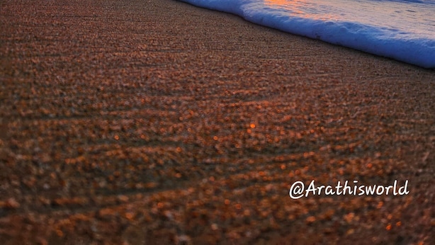 A beach with waves at sunset, clear sky, and distant buildings. - 2 units | Sleeps 12 | Beach | Pool | Sunsets | Fun (Aguada)