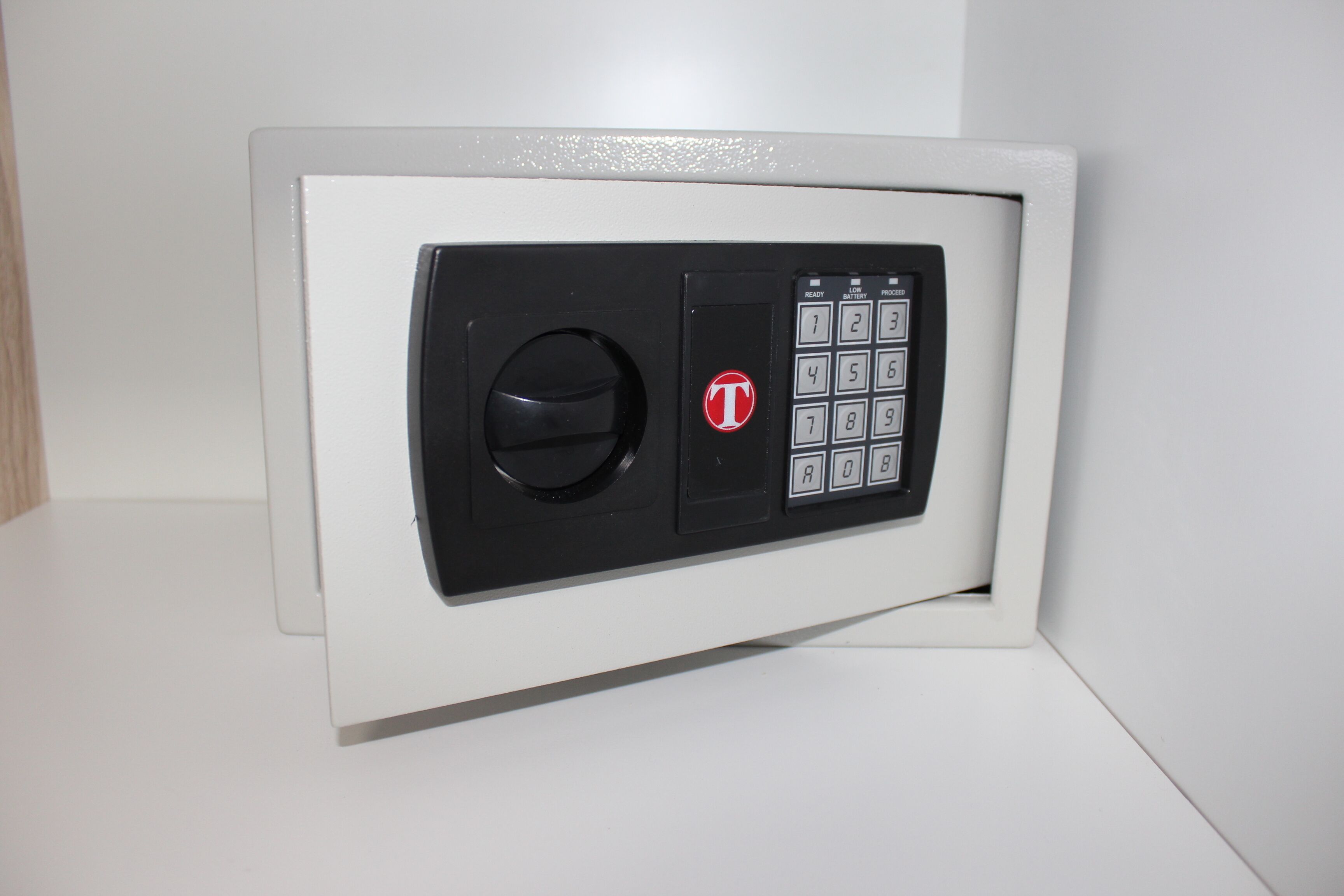 A safe with a keypad and a combination lock.