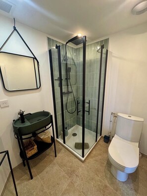 Shower, hair dryer, towels, soap