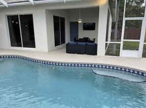 Outdoor pool, a heated pool - Retreat at Genoa (Port St. Lucie)