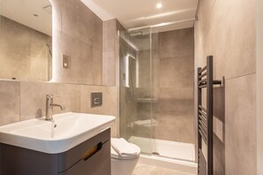 Bathtub, hair dryer, towels