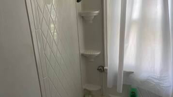 Bathtub, hair dryer, shampoo