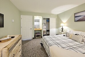 A bedroom with a bed, a dresser, a desk, and a chair. - Amazing Ocean View Suite - Sleeps Six - Pool Access & Hot Tub! (Lincoln City)