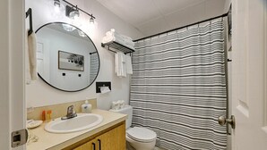 Combined shower/tub, hair dryer, towels, shampoo