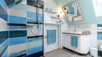 Shower, hair dryer, towels, soap