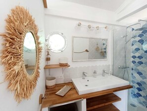 Shower, hair dryer, soap, toilet paper