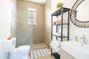 Shower, towels, soap, toilet paper