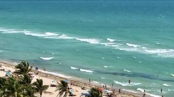 On the beach, sun loungers, beach towels